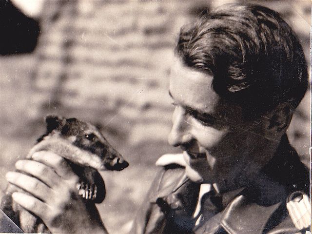 'Poldi plays with the squadron's pet Nassenbären (racoon)