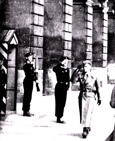 Someone snapped this picture of&nbsp; Lieutenant Wenger being saluted as he walks past sentry guards on May 7, 1941 in France.