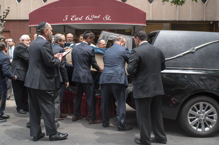 Outside the Orthodox 5th Avenue Synagogue on July 3, 2016, Wiesel’s coffin is placed into the back of the hearse.