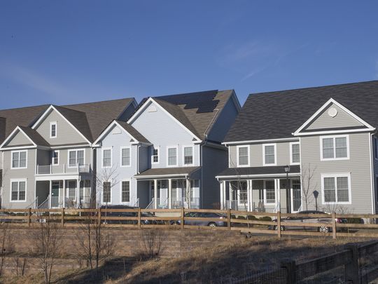 Endless rows of new homes keep going up - these a part of Pine River Village across from a shopping center.