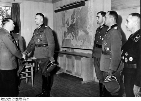 The Fuehrer greets officers at his Wolfsschanze headquarters in West Prussia in Sept. 1943.