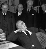 FDR at ease and pleased after signing war declaration against Japan, 1941.