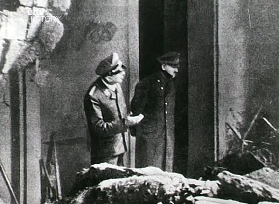 The last photograph of Adolf Hitler viewing the destruction outside the entrance to the Führerbunker.