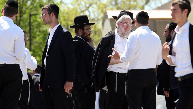 Beth Medrash Govoha Yeshiva students assemble outside the school in Lakewood