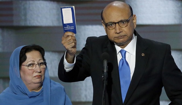 Khizr Khan holds up a paperback U.S. Constitution