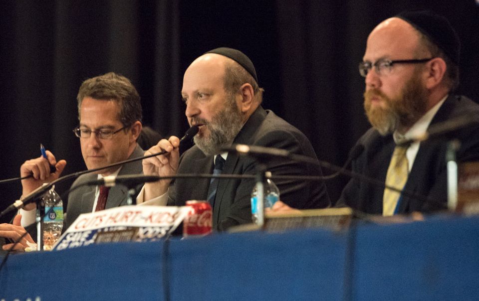 Jewish members dominate the school board. Above, Lakewood BOE president Barry A. Iann (center) comments during a May meeting