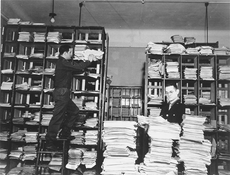 US Army staffers are organizing stacks of German documents