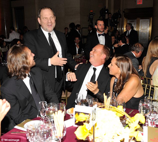 Harvey Weinstein (standing), Michael Kors (center seated) and Donna Karan (right) 