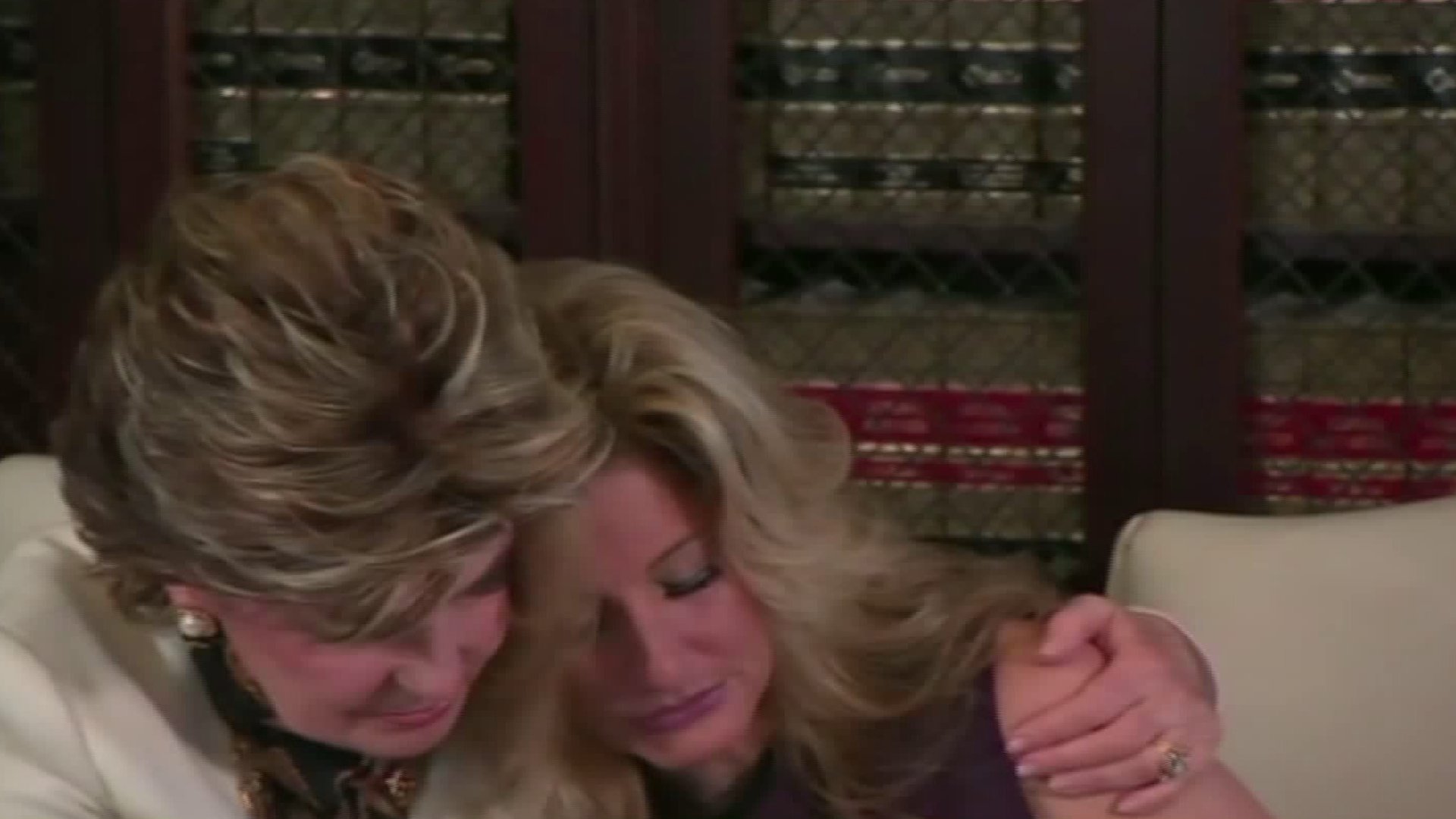 Feminist Attorney Gloria Allred comforts her client Summer Zervos