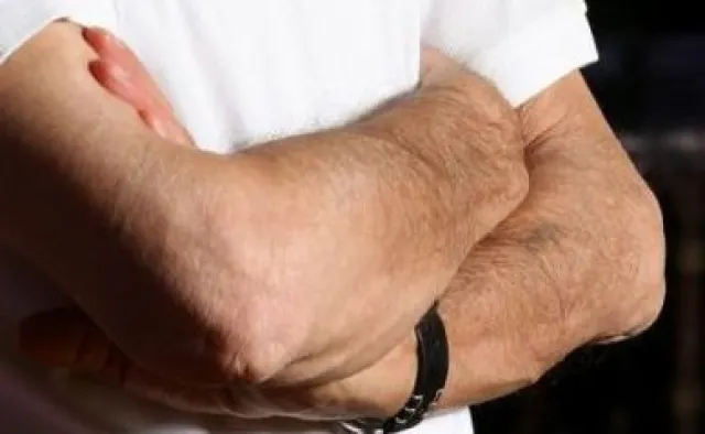 Close-up of Elie Wiesel’s arms